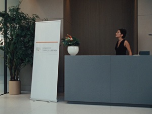 Retractable banner display in hotel lobby — professional interior signage printing